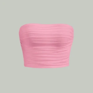 Rosa tubtopp  - Säljer en rosa tubtopp från SHEIN. Toppen är croppad och har ett rynkat tyg som ger en snygg effekt. Perfekt att matcha med jeans eller kjol för en trendig look.