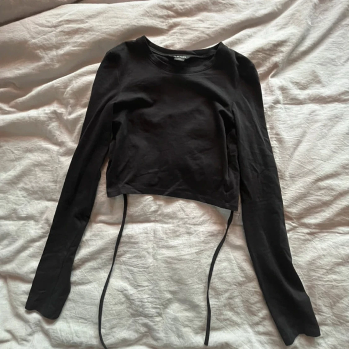 Svart topp med öppen rygg - 1