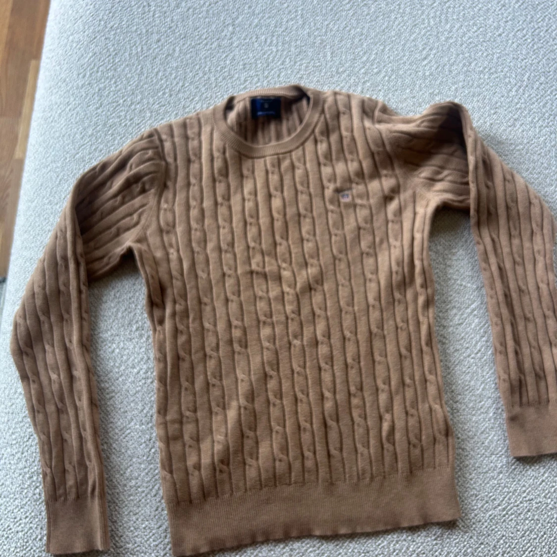 Beige kabelstickad tröja från Gant