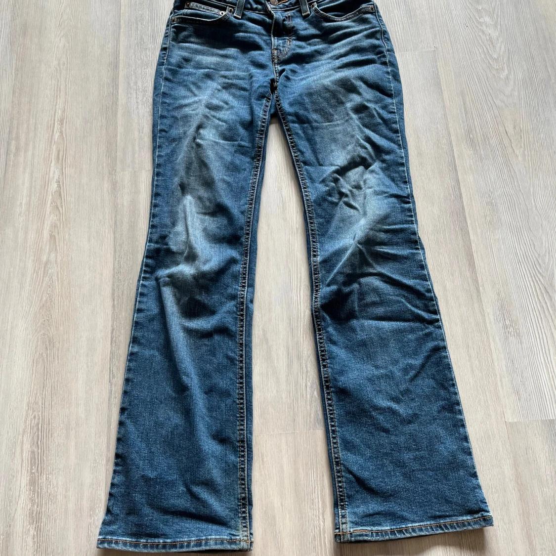 Superlow bootcut jeans blå, stl 25