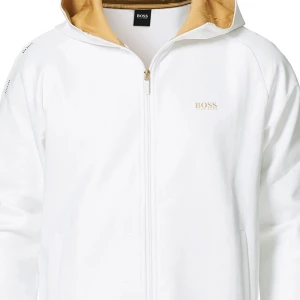 Hugo boss kofta - Snygg vit zip up från Boss med dragkedja och guldfärgad insida i luvan . Äkta såklart i storlek S (män storlek) men skulle defentetivt säga att den passar en M också använd max 5 gånger super bra skick och svår att få tag på 