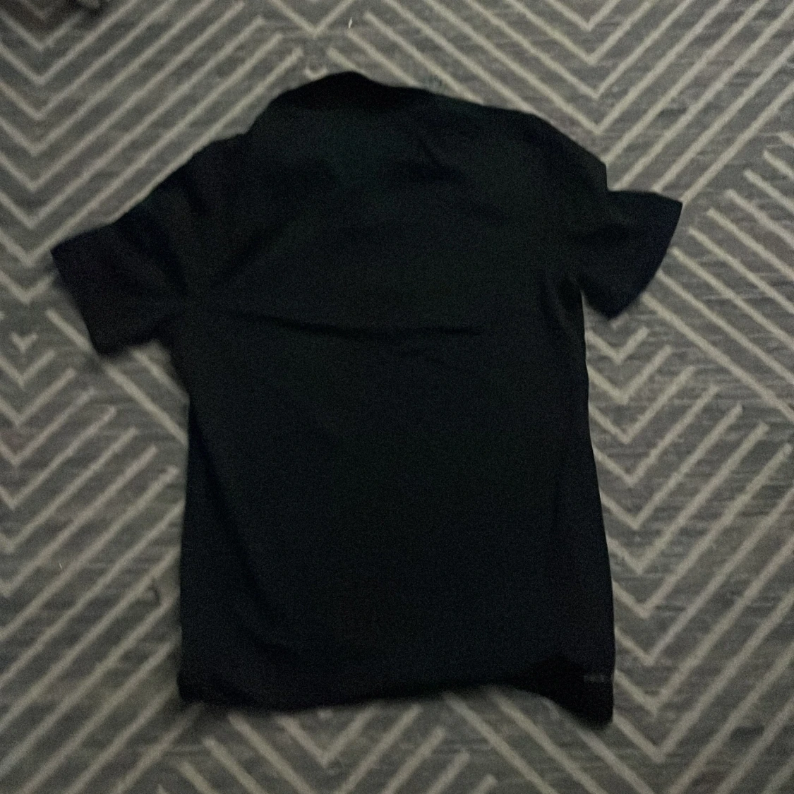 Svart pikétröja från Nike i S - 2