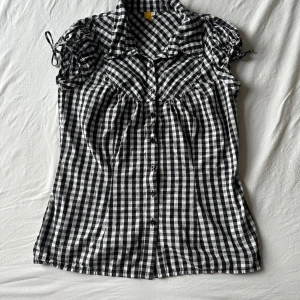 gingham blus - in great condition apart from a very small spot by the button (see photo) but not visible when wearing  marked as a size 42 but fits very nicely on a size 36
