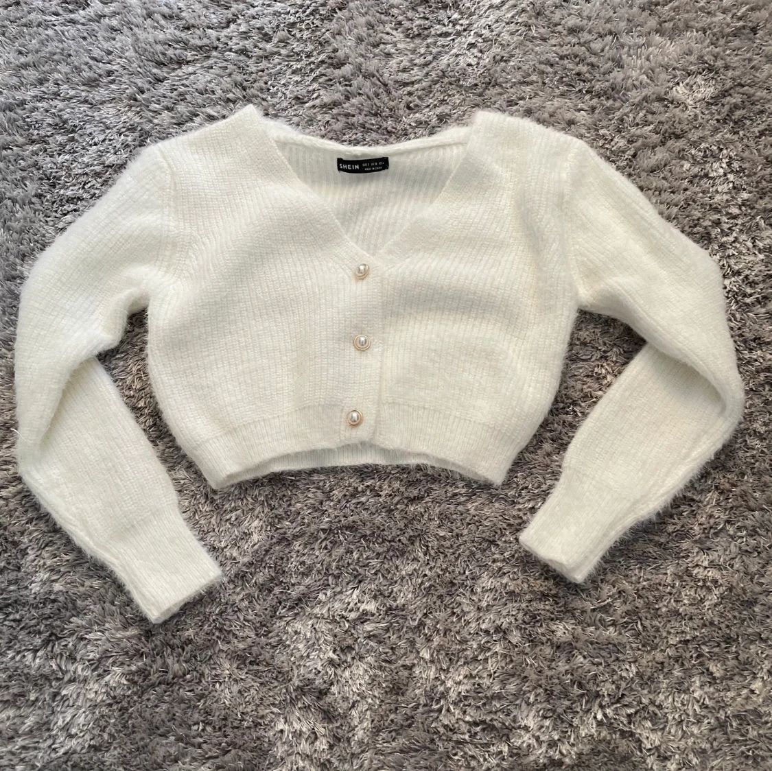 Kroppad stickad kofta