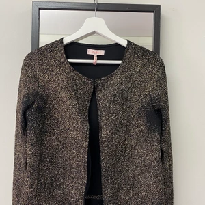 It's from Australian brand millers, size 10 - Black light coat with golden dots, can be wear in summer. 