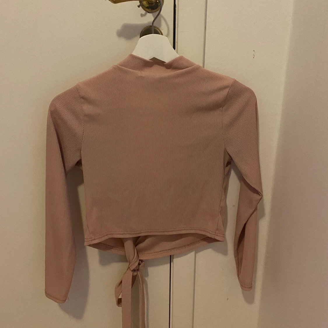 Oöppnad rosa v-ringad tröja  - 91