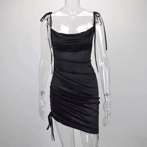 Black ruched satin dress. The length is adjustable as you want, very new condition 