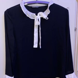 Black bell sleeve blouse - Black bell sleeve blouse, with a self tie neck.