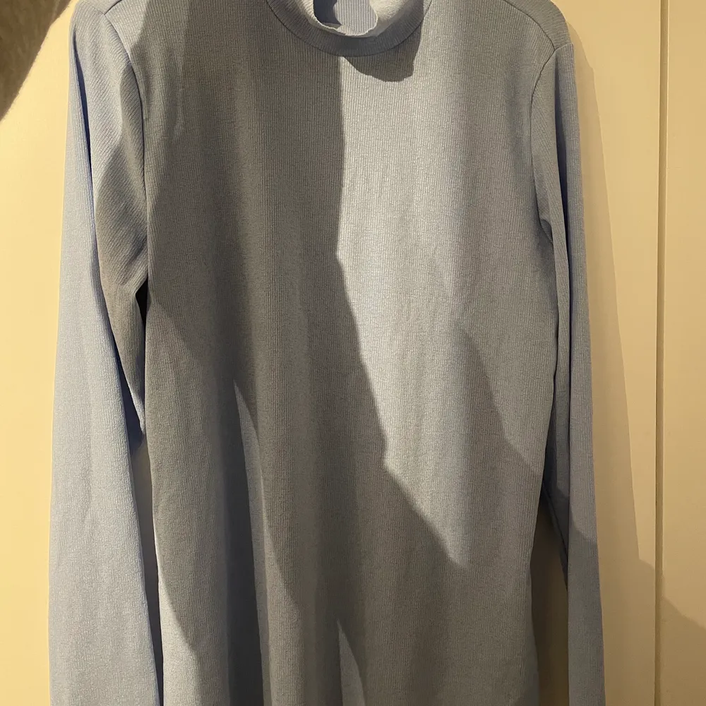Light blue mesh turtleneck in perfect condition!. Stickat.