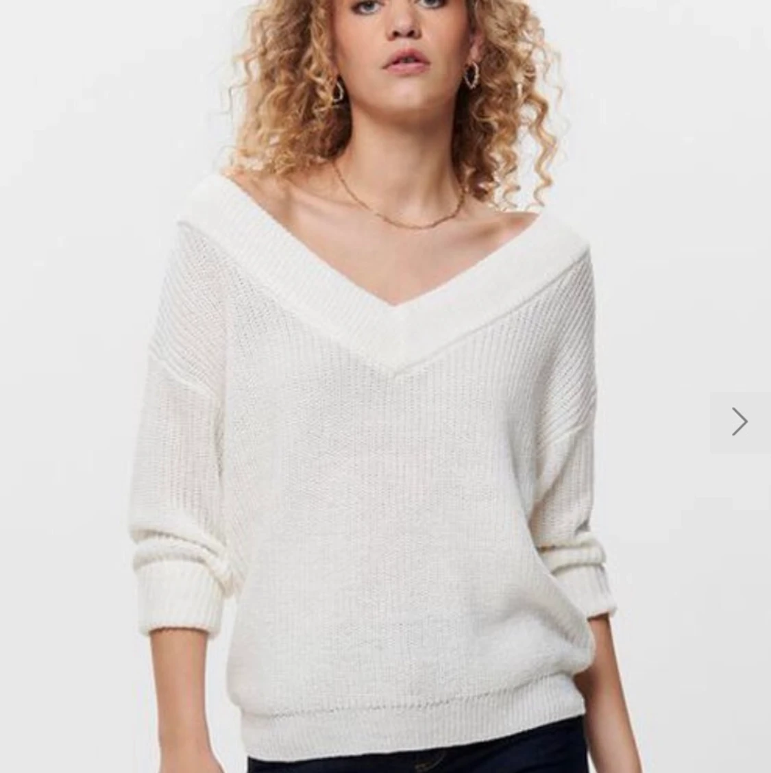 V ringad stickad tröja