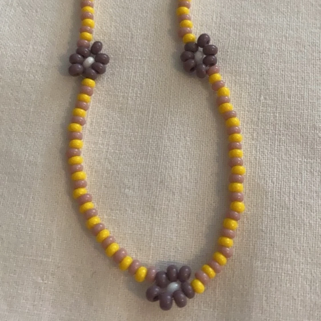 Halsband blommor - 90