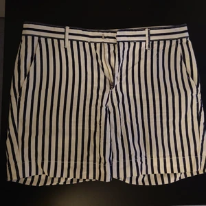 White and navy striped shorts  - Size S but definitely suitable for M too since hip measures are quite large. I can provide the measurements, just ask :) wore the shorts for couple of weeks last summer but I have grown out of them. 