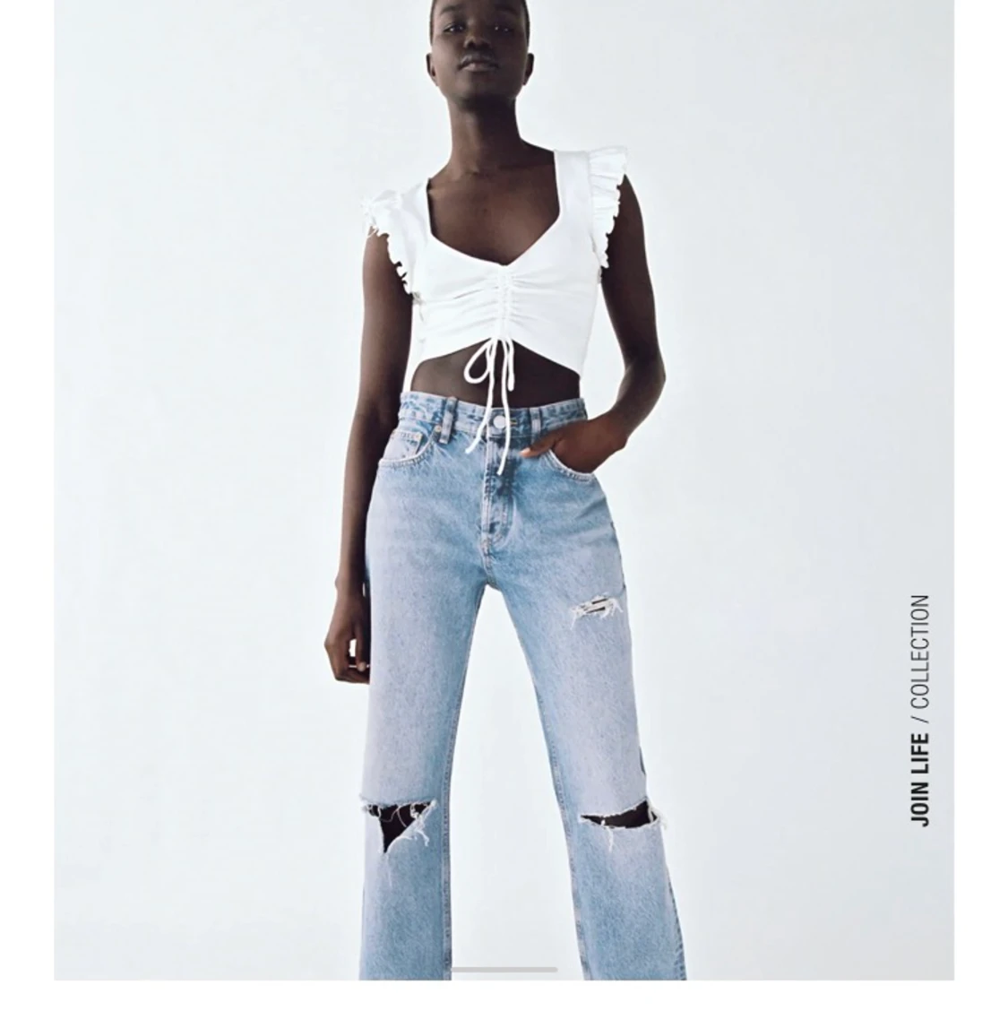 Vit crop top, linne med volanger i storlek M