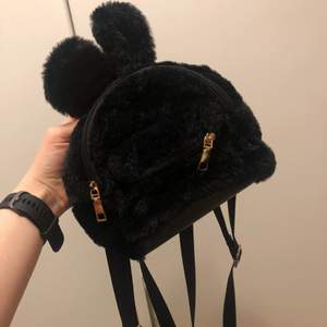 Worn once. Bought in Los Angeles. Cute furry bunny backpack