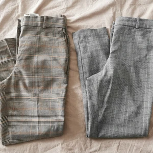 2 par kostymbyxor från H&M strl 38  - Två par rutiga kostymbyxor från H&M, ett par gråa och ett par beige/bruna. Båda är i storlek 38. Båda två tillsammans säljes för 50 kr. 