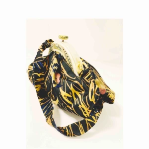  - Unique petite pouch with intricate details and gorgeous carved pattern.