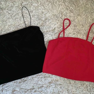  - Säljer båda för 100! Toppar från Nelly (svart) och ASOS (röd). Aldrig använda!
