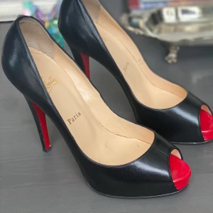 Louboutin heels - Beautiful black heels for the risk taker! They size a bit small