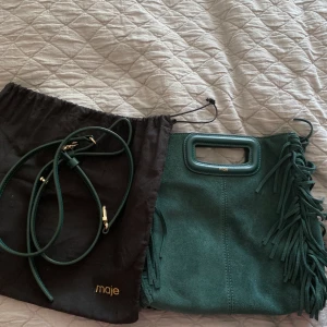 Maje väska i nytt skick - Helt ny Maje väska, använd 3-5 gånger. Köpt för 1998kr och tar emot vilket bud som helst.