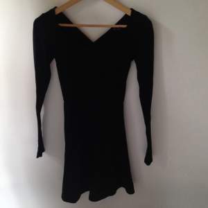 American Eagle Outfitters, black dress with cross in the back  and a bit of open back 