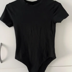 T-shirt body - T-shirt body från Primark Storlek xs 