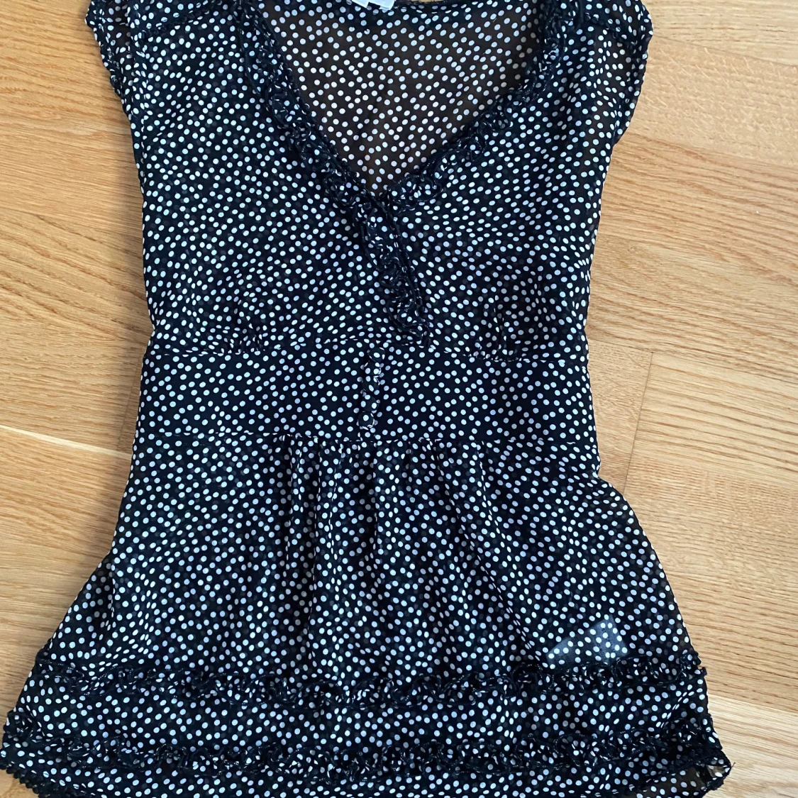 Svart prickig blus från Stockh LM