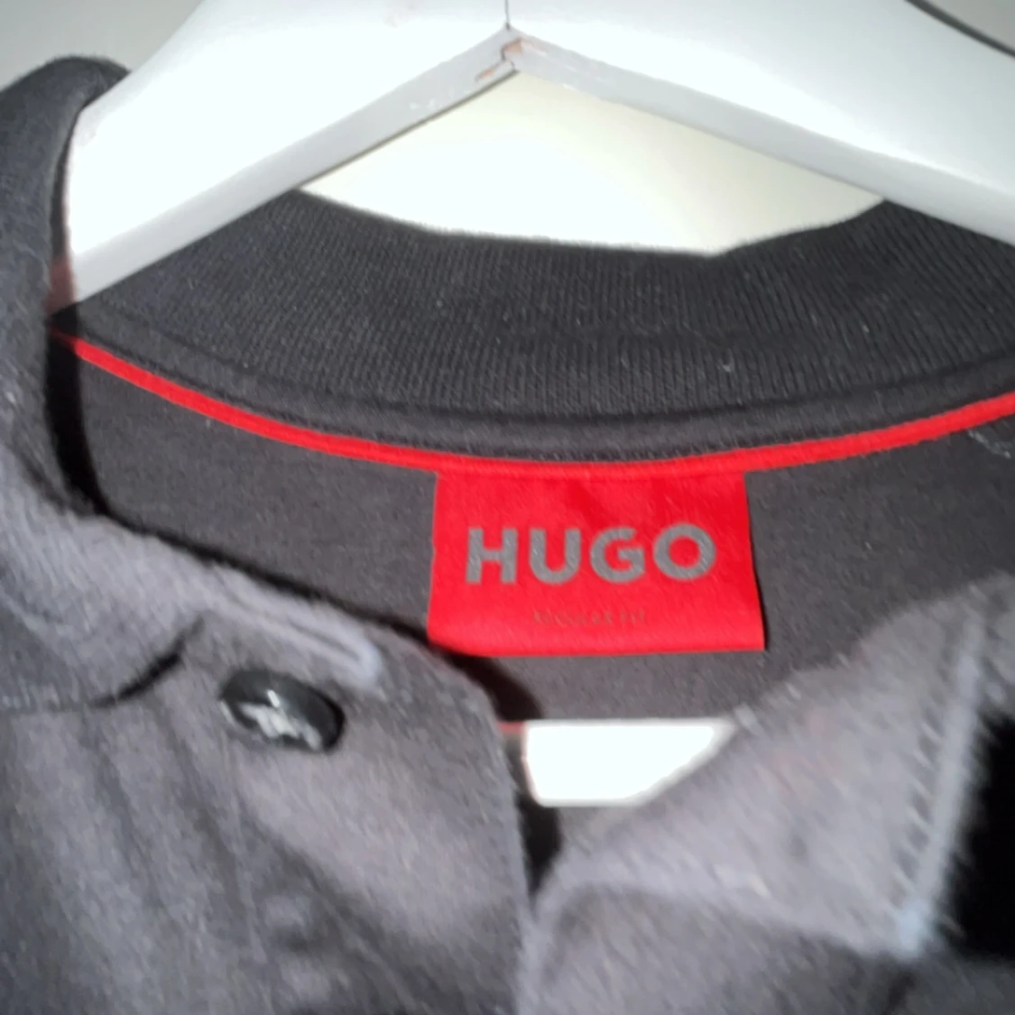 Svart kortärmad piké från Hugo - 90