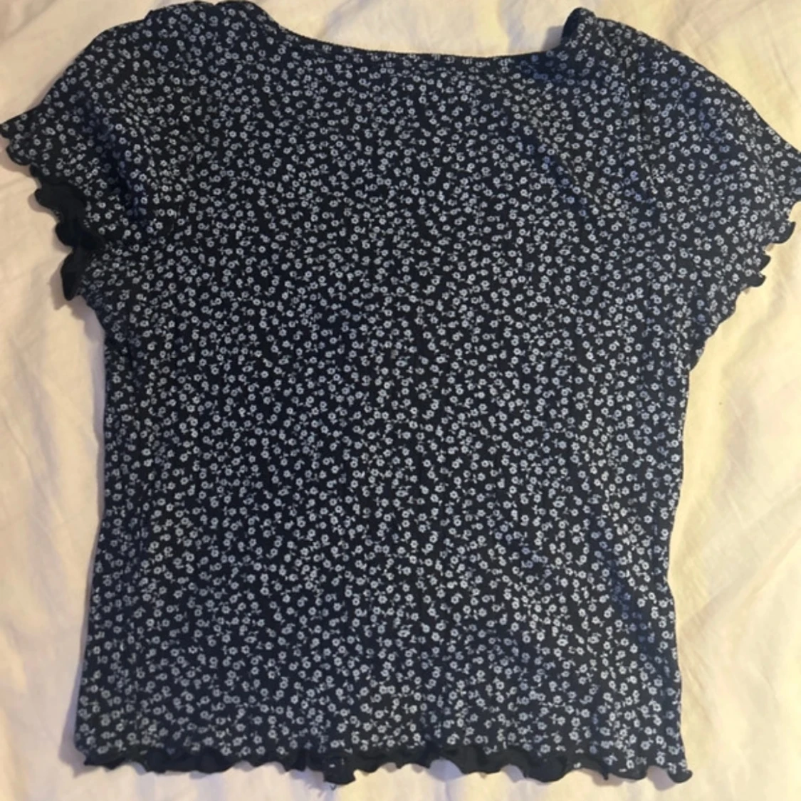 Svart blommig topp med knappar Brandy Melville - 90