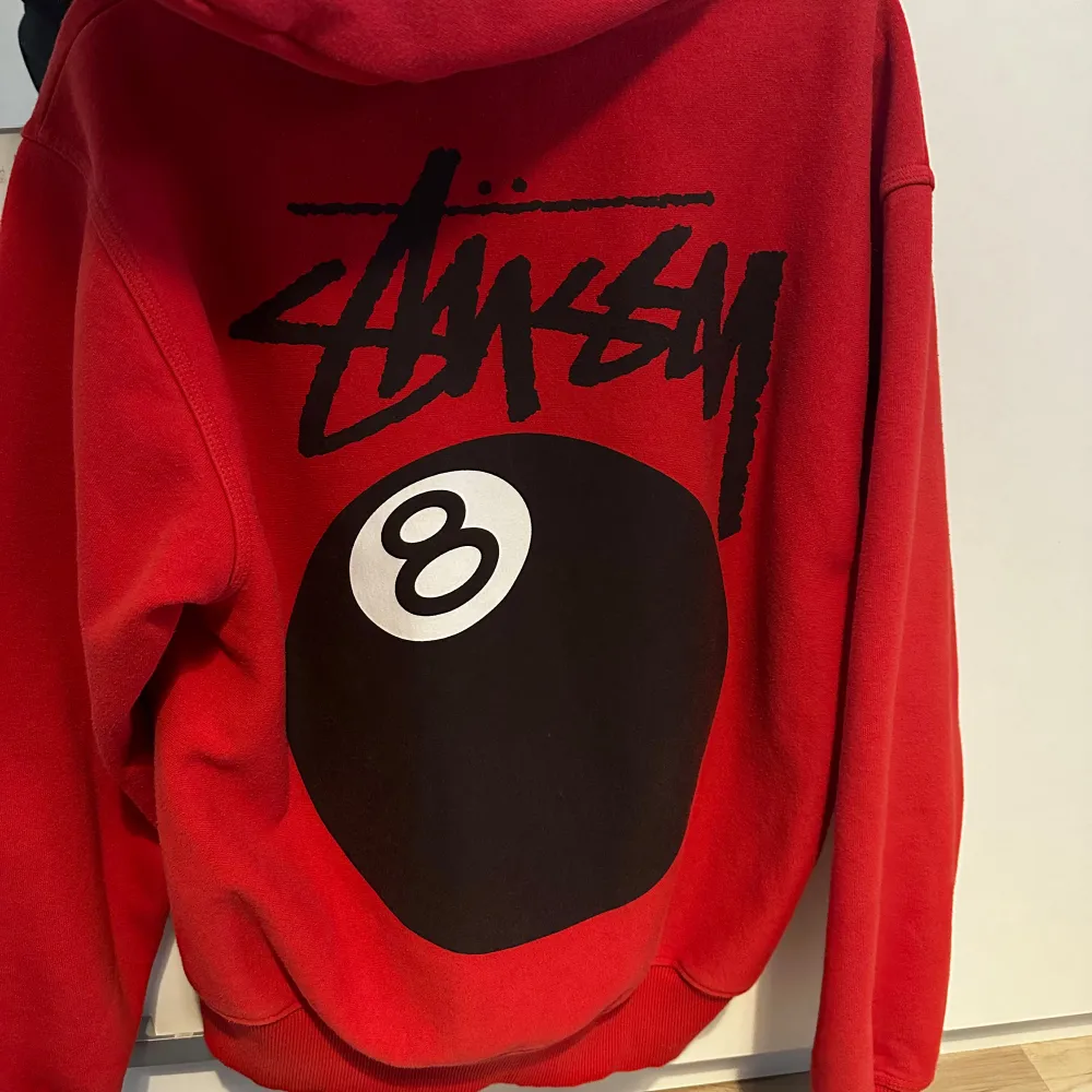 This one is a masterpiece from Stüssy With the 8 ball design on the back. . Hoodies.