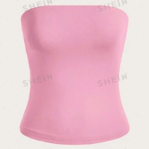 Rosa tubtopp från SHEIN - Snygg och enkel rosa tubtopp från SHEIN. Perfekt för sommardagar eller som ett basplagg i garderoben. Den är axelbandslös och har en tight passform som framhäver figuren.