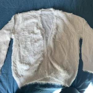 Super offer! Faux Fur Crew Silver - A trendy NEW long sleeve elegant faux fur crew sweater in Small size. Perfect for the season!   Fully new!