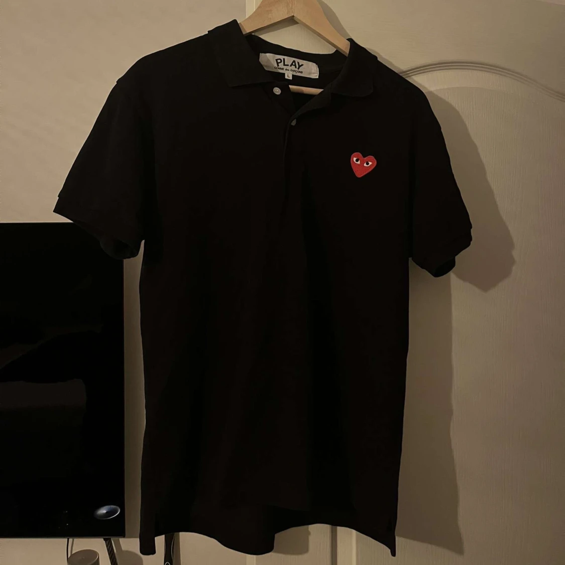 Svart pikétröja från Comme des Garçons