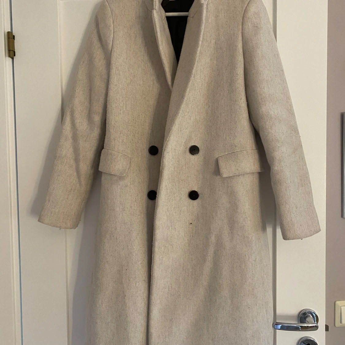 Beige kappa från MNG