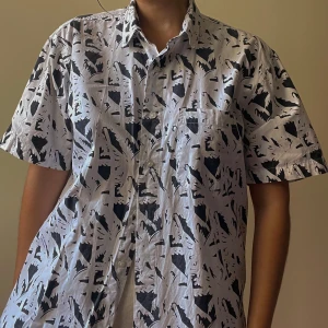 Abstract Print Cotton Shirt - Best Fits Size S-M   White Button Down Cotton Shirt with an Abstract Print that can be thrown on for a casual fit