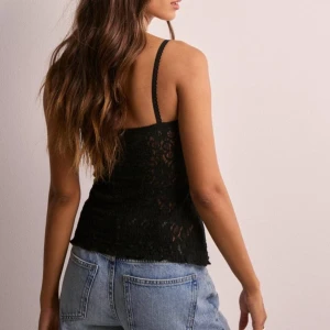 Stunning lace topp  - Svart spets topp från Nelly. Aldrig använt 