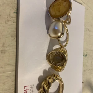 Ringar  - Fyra ringar + 1 ring