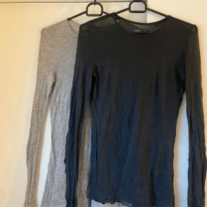 2-pack genomskinliga tröjor  - 2-pack genomskinliga tröjor från märket oysho. 1 grå & 1 svart, båda i storlek S. Väldigt tunt material och inga defekter vad jag kan se. Stretchigt material 