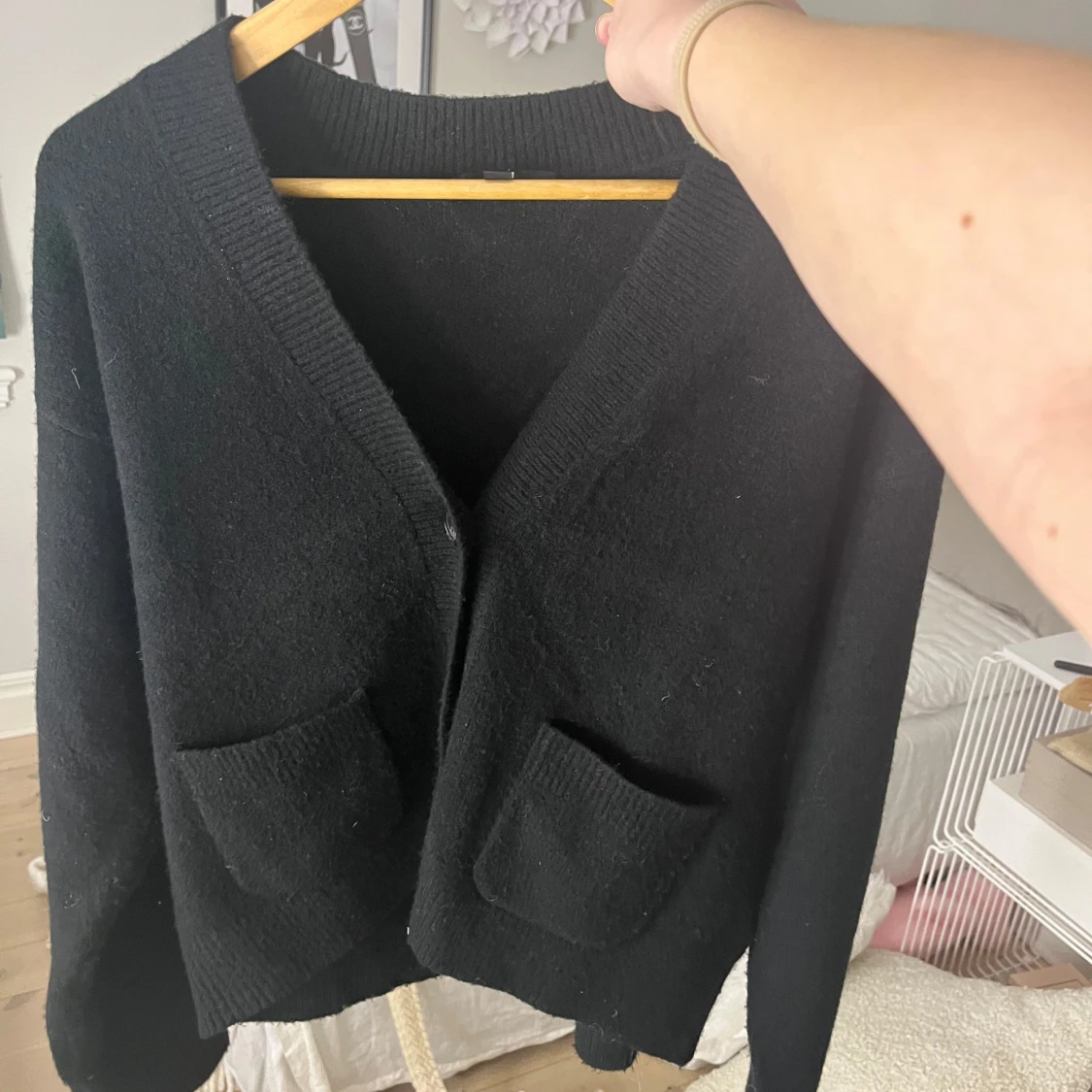 Svart kofta med fickor