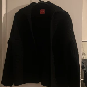 Kofta  - En svart kofta