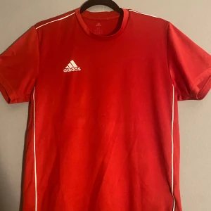 Adidas red training/compression shirt good quality M - Adidas red training shirt Size M but fits L used but still good quality 