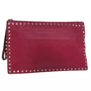 Valentino clutchväska - DETALJER Serienummer: - Tillverkad i:  Italien Material: läder Färg: rosa och guld Tillbehör: inga  FÖRUTSÄTTNING​ Utsida: I gott skick, med några små tecken på användning.   Insida: I gott skick, med några tecken på användning.  