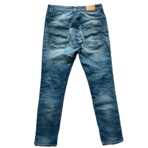 Nudie Jeans - Asfeta Nudie Jeans. Modellen e thin finn. Skicket är som nytt, oanvänt.