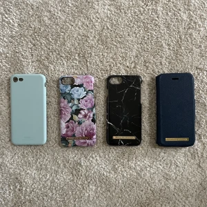 Mobilskal iPhone 8 - Skal till iPhone 8, använda men i fint skick! 3 stycken är från Ideal of Sweden och det andra är från Holdit.