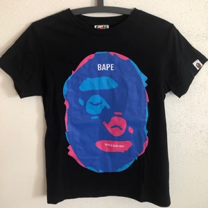 Women’s Bape Ape Twin Head Tee - Women’s Bape / A Bathing Ape Twin Head T-Shirt  Size small, women’s fit.  Great condition, no flaws or damage.  DM if you need exact size measurements.   Buyer pays for all shipping costs. All items sent with tracking number.   No swaps, no trades, no offers. 