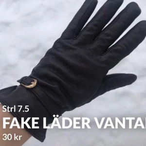 Vantar -  Bruna läderhandskar.
