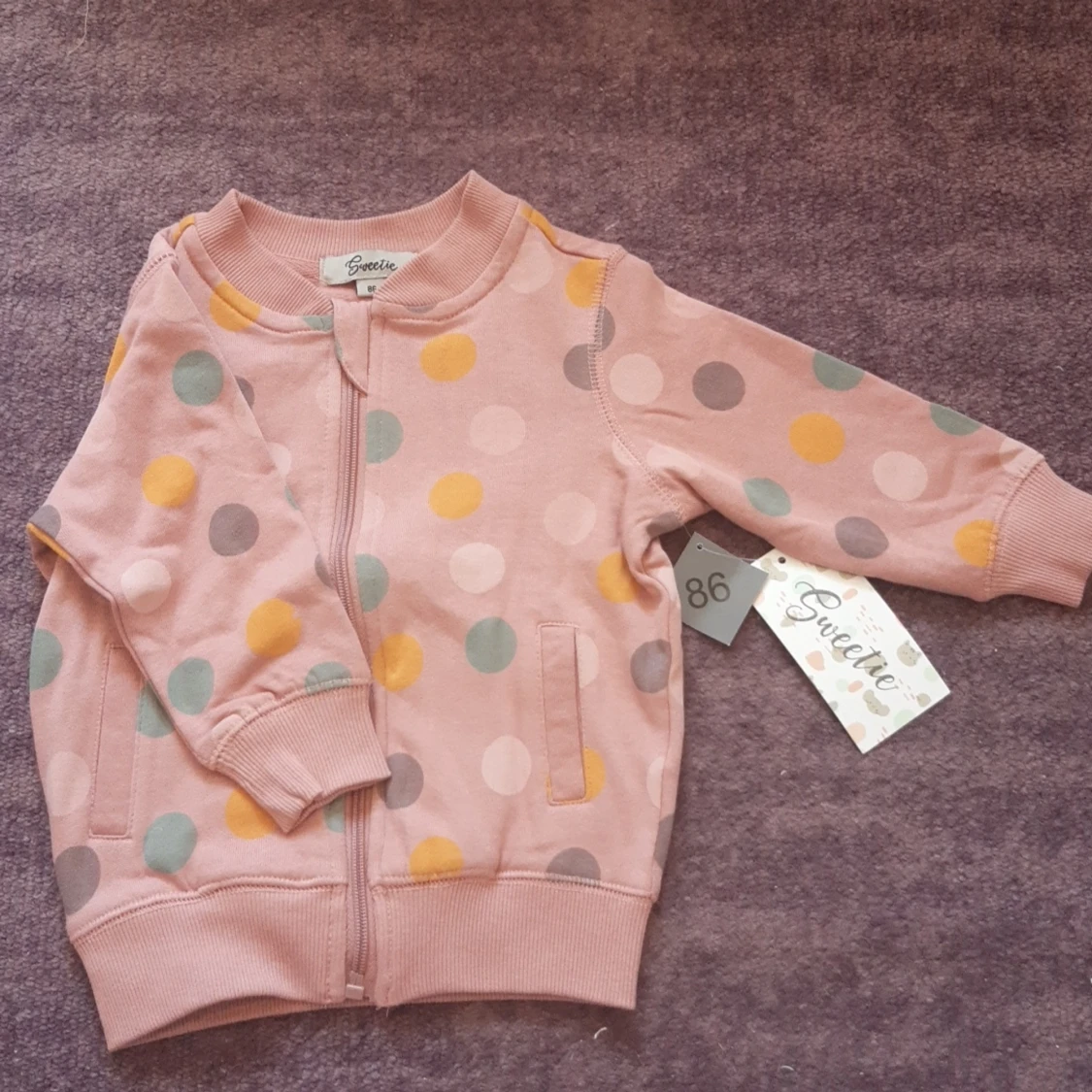 Prickig långärmad med dragkedja