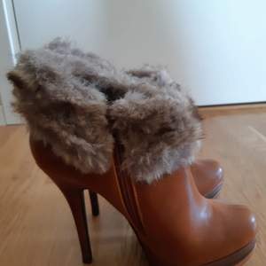Fancy boots with imitation fur. Very comfortable and warm. Brand new. Never used