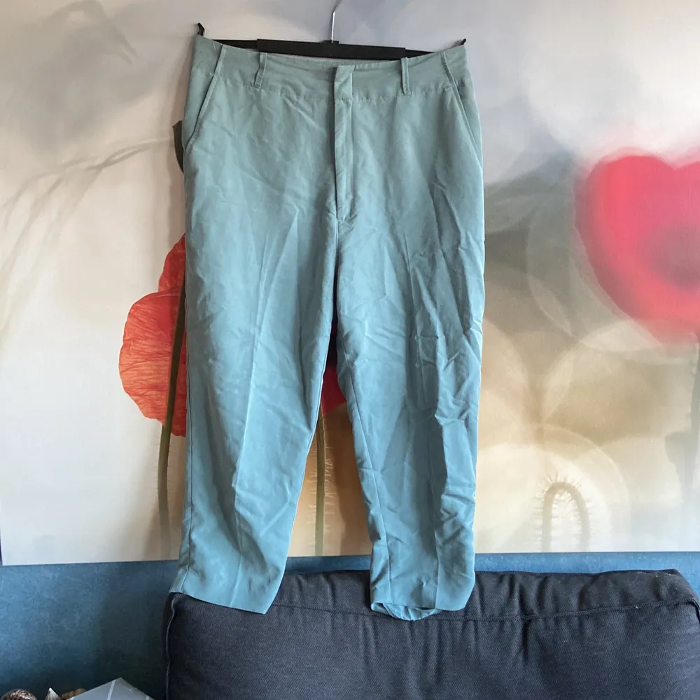 Turquoise trousers in the size L/XL, Second hand bought . Jeans & Byxor.