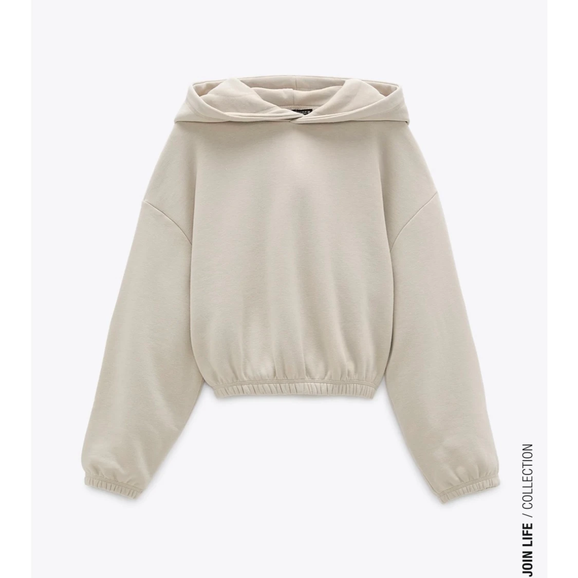 beige huvtröja/hoodie