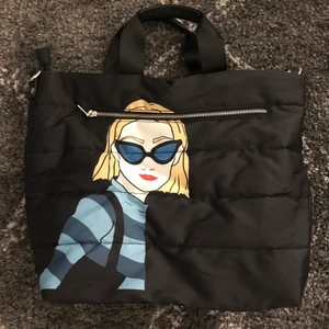 Parfois bag with print - Black parfois tophandle bag, water proof, with print on both sides. Never worn so in great condition. Comes with crossbody strap. 